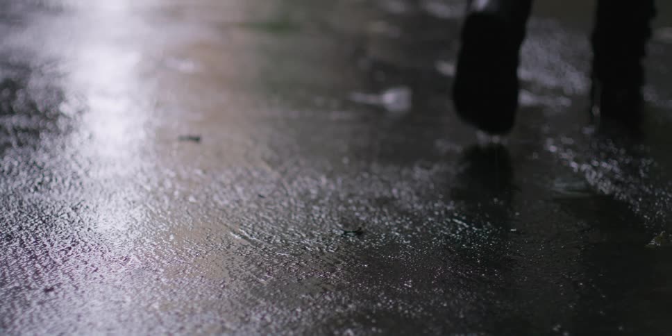 A person walks in the rain