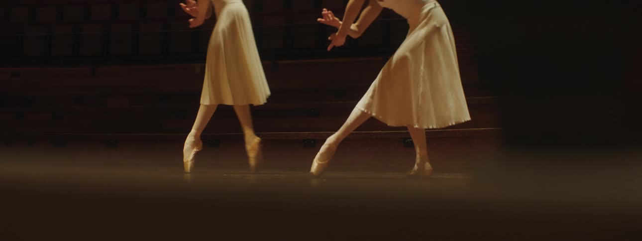 Two women are dancing on stage