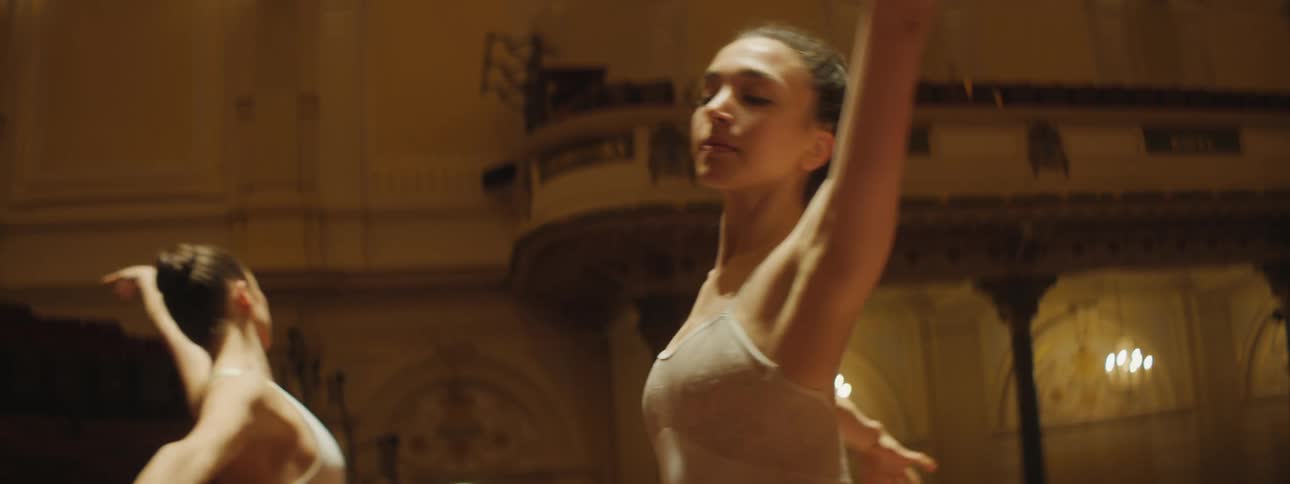 Two woman are dancing in a room