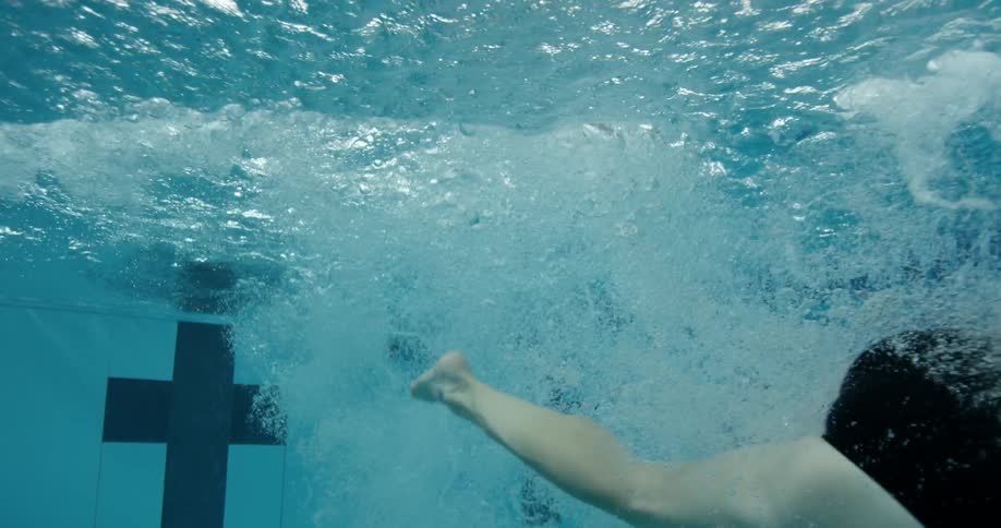 A woman swims in a pool