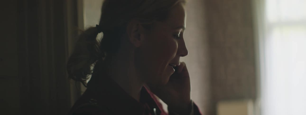 A woman is talking on her cell phone