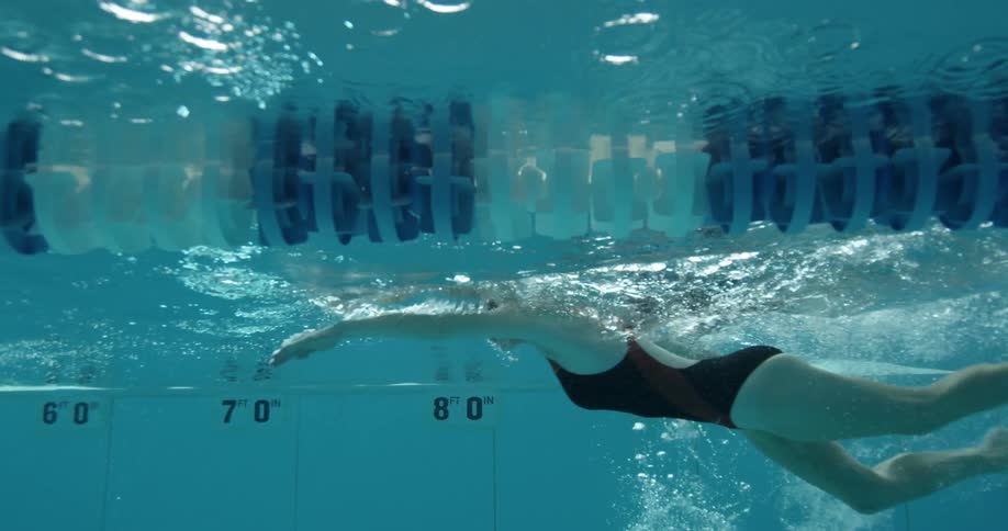 A woman swims in a pool
