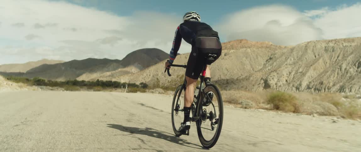 A man is riding his mountain bike