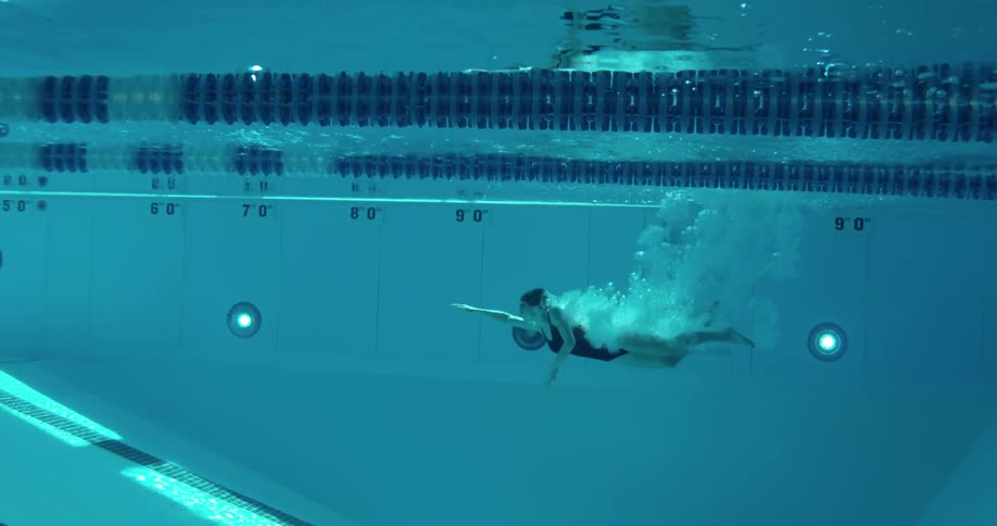 A woman swims in a pool