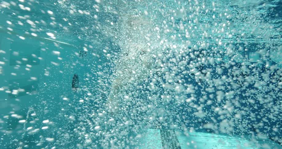 A woman swims in a pool