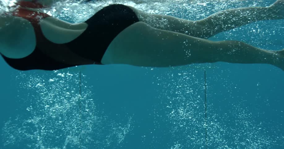 A woman swims in a pool