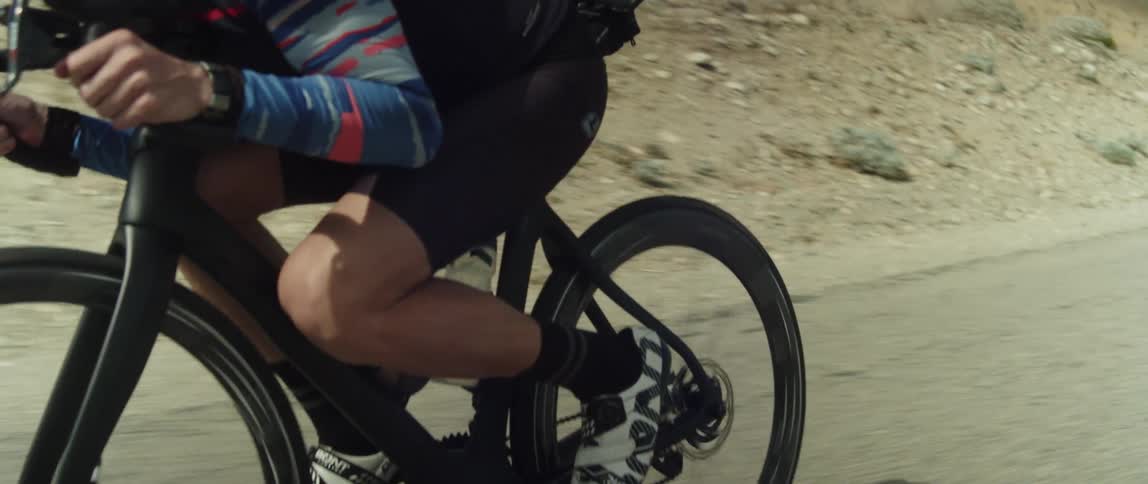 A man rides his mountain bike on the road