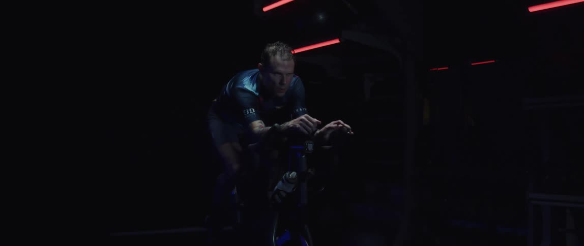 A man riding a stationary bicycle