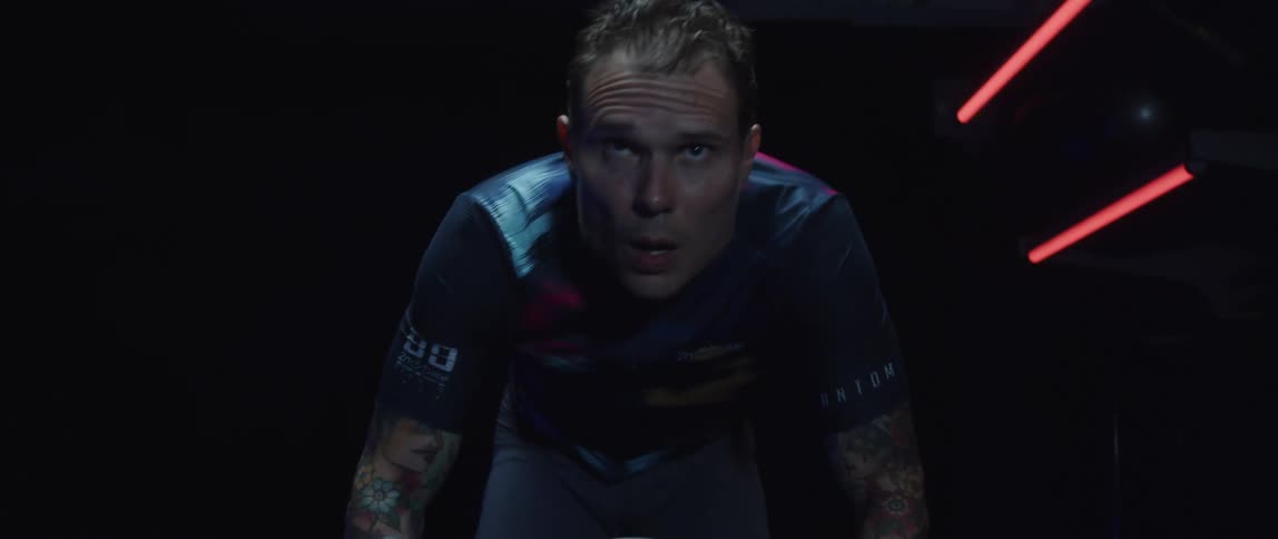 A man exercising on a stationary bike