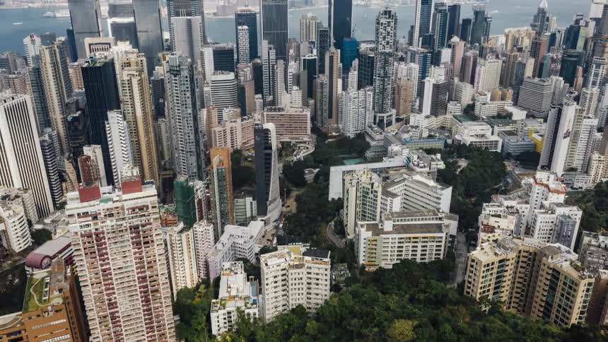 A large city sprawls on both sides of a river