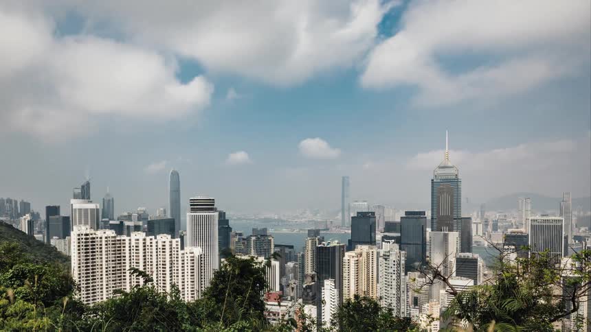 Dense clouds move over tall skyscrapers downtown