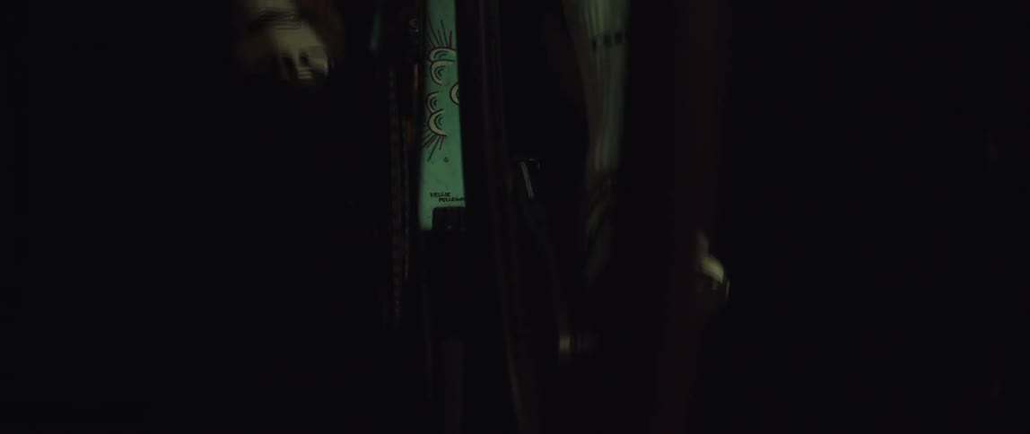 Person pedaling bicycle in the dark wears socks