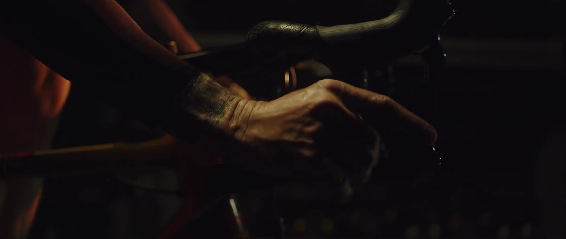 Man pedals and manipulates bike controls