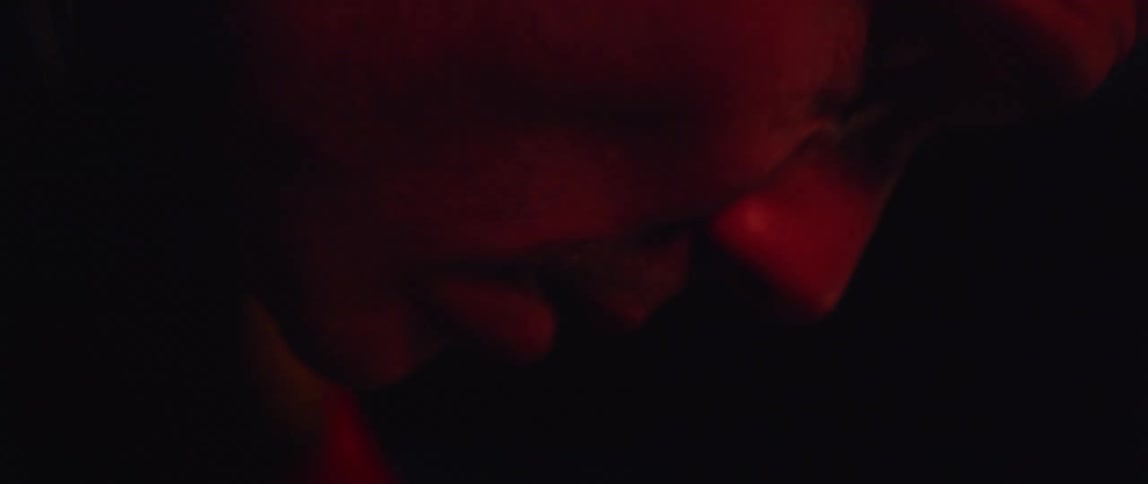 A man raises his head and looks around