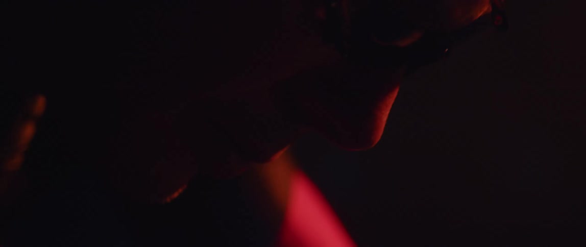 A view of a persons face with a red light