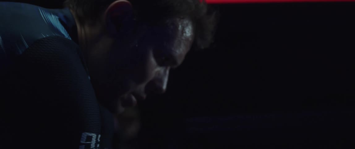 A man is doubled over catching his breath