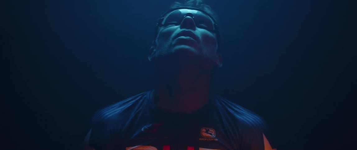 A man is standing and stretching his neck