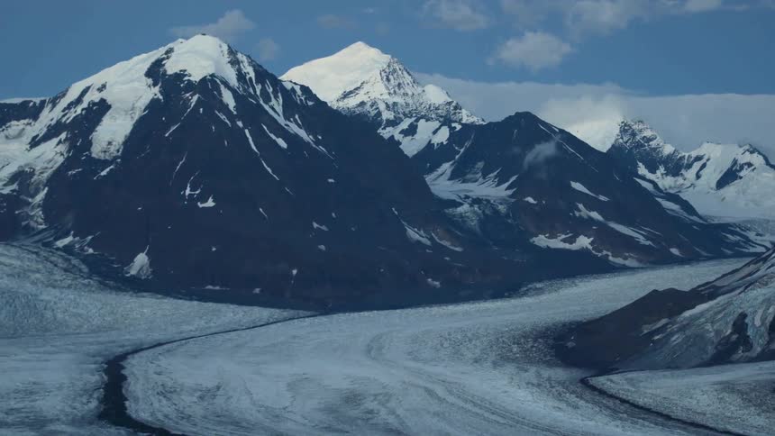 A mountain range is covered with snow