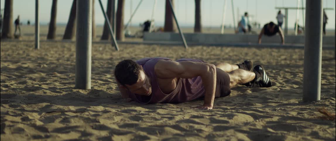 People are working out at the beach during midday