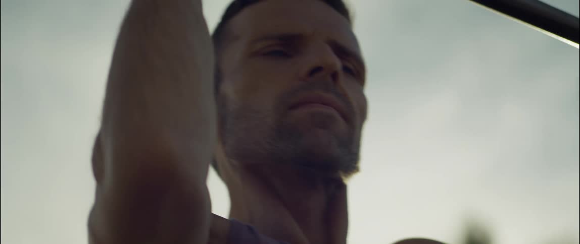 A man lifting weights outdoors