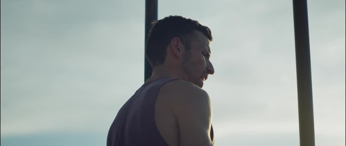A man is working out on an overcast day