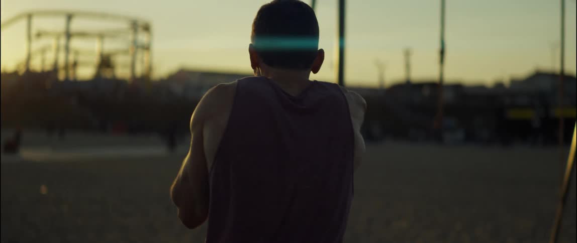 A view of a person shadow boxing outdoors