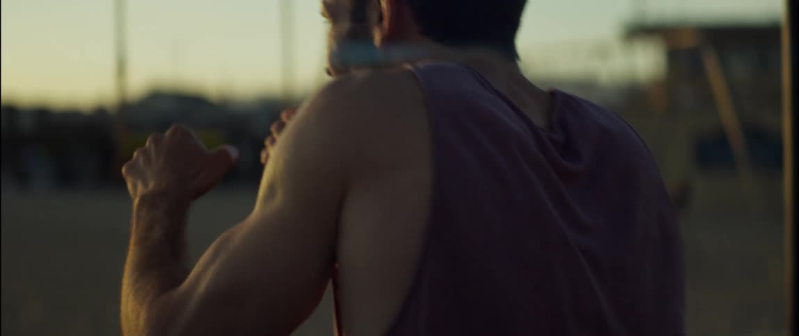 A man throws punches as he exercises at a park