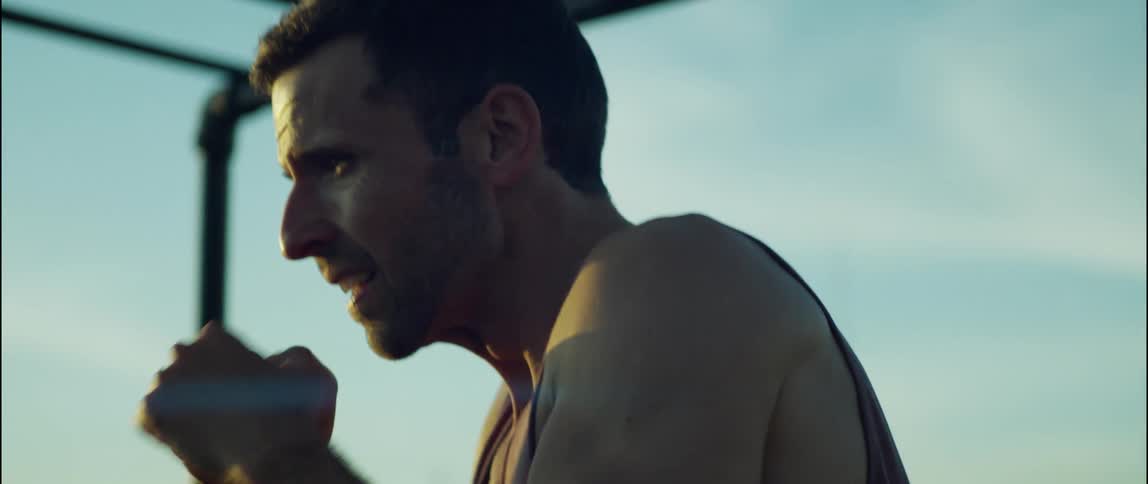A man is boxing the air on a playground