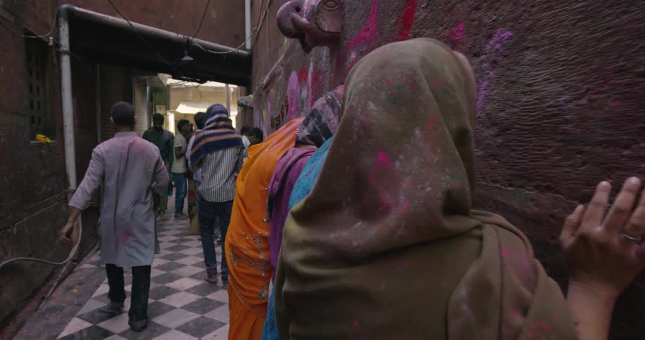 People walk down an alley