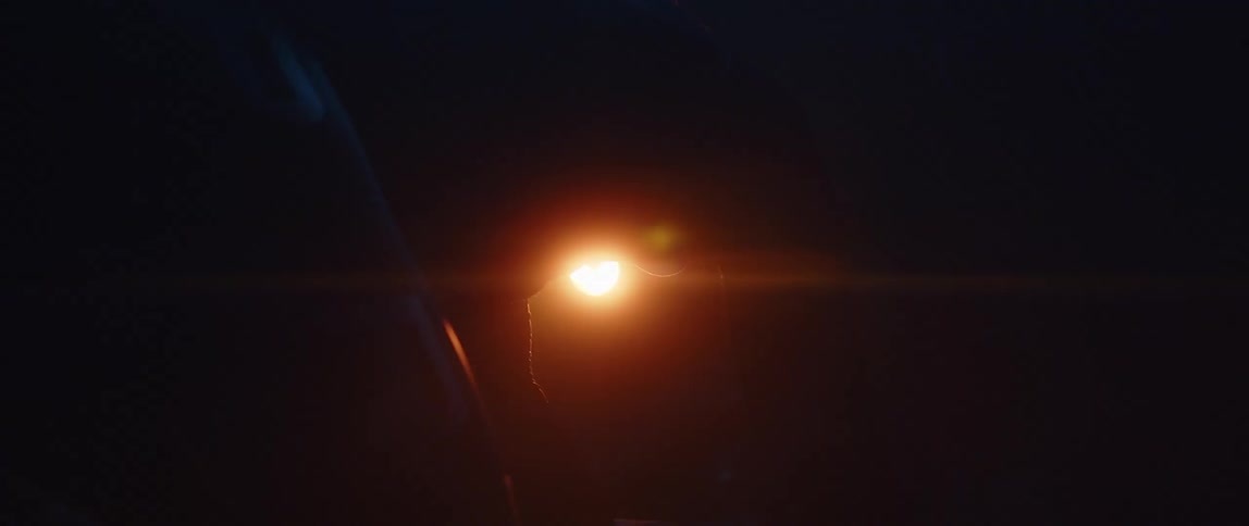 A flare is shown outdoors during the night time