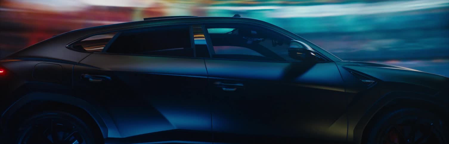 Surrounding city lights streak around car