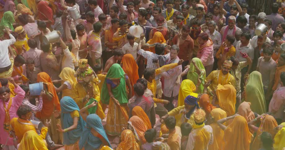 A group of people dance outdoors