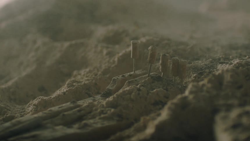 Dust blows over land covered in sand