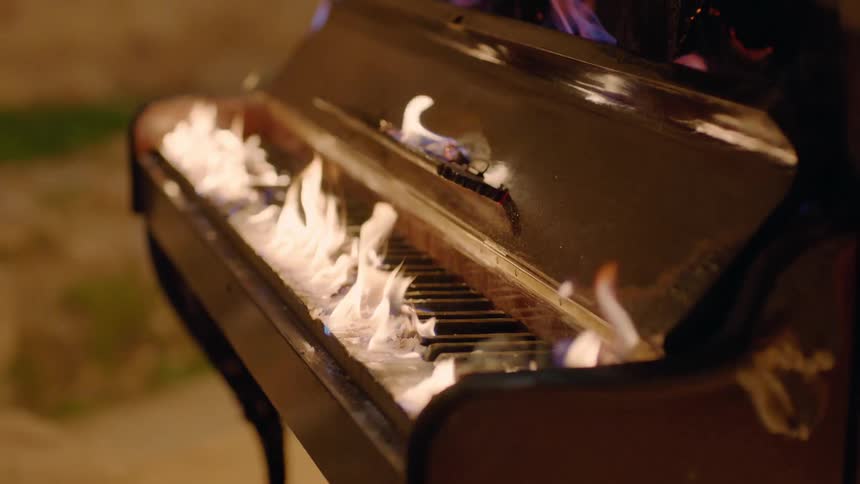 The piano is covered in flames