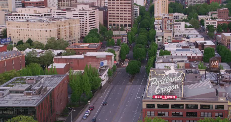 A sign welcomes drivers into downtown in the city of portland oregon