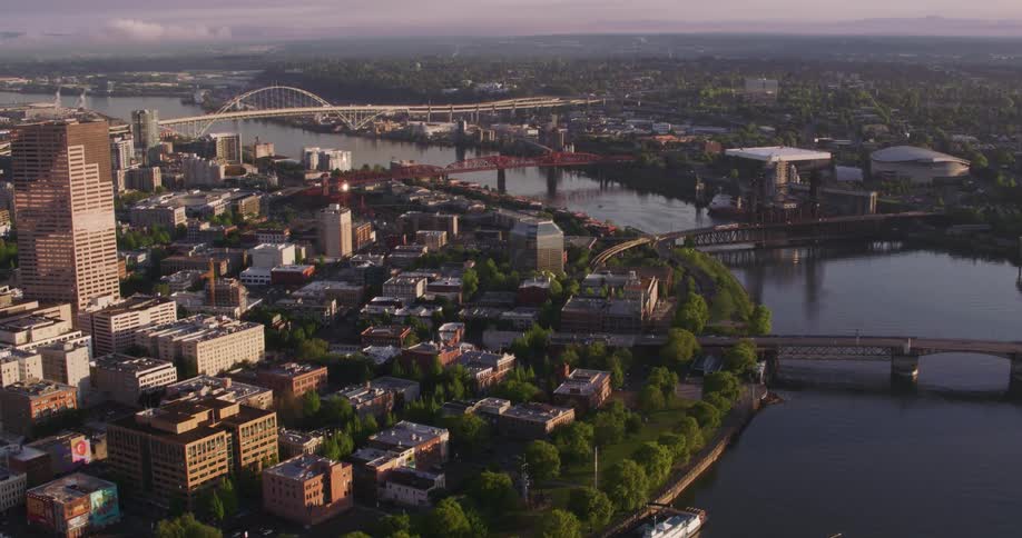 Aerial view of multiple bridges over a river crossing through a city