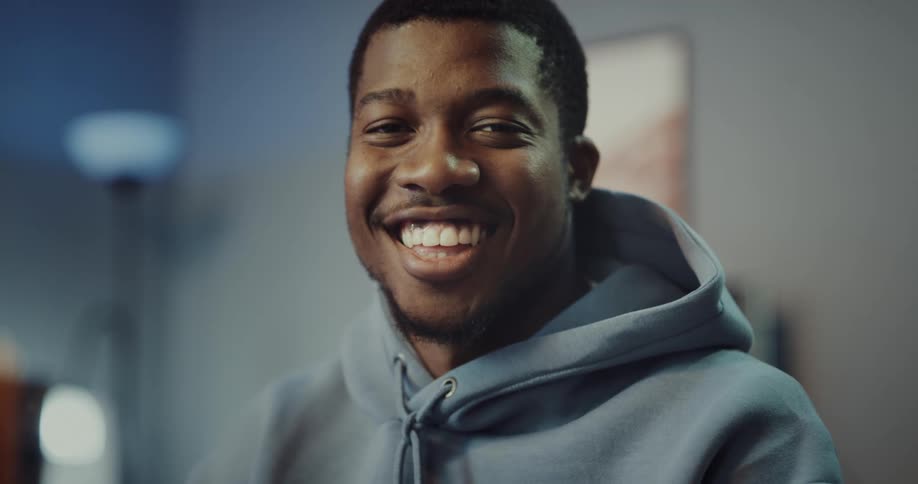 A man smiling and laughing with teeth showing