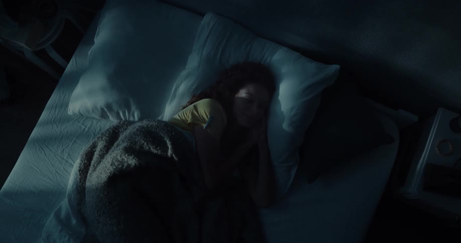 A woman is sleeping in bed