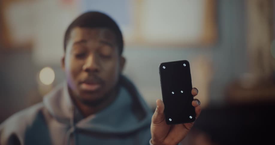 A man is holding a cell phone
