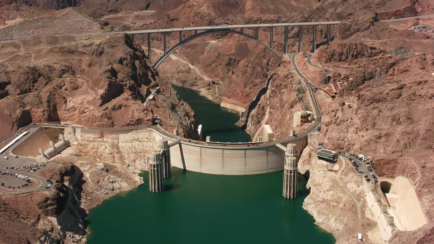 Cars traveling across the pat tillman memorial bridge over the hoover dam and colorado river