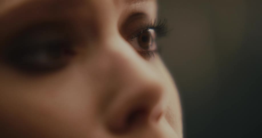 Woman stares teary eyed