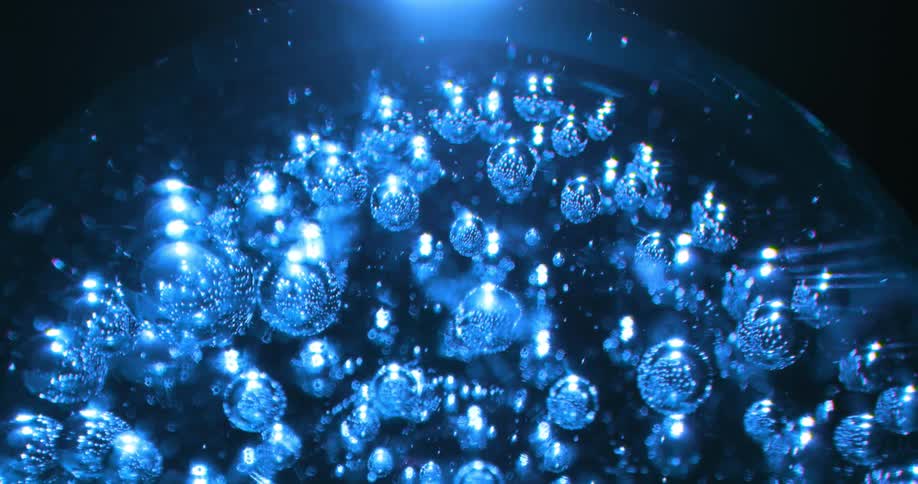 Air bubbles inside a glass globe seem to float as the crystal ball turns