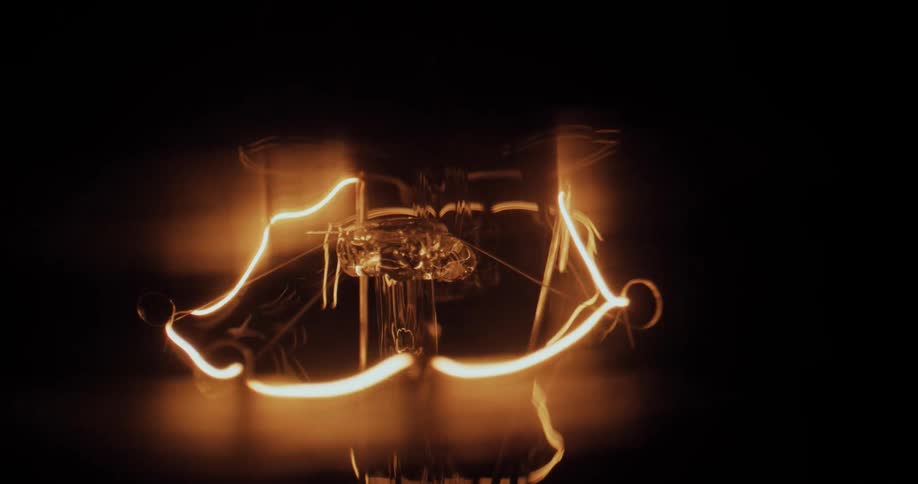 A trick using slow shutter speeds captures lines of light floating around a glass pedestal