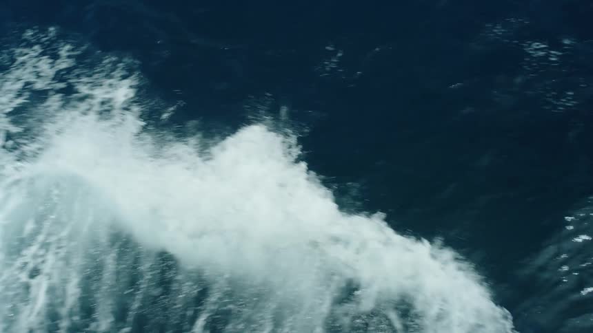 Ocean waves splashing foaming and breaking