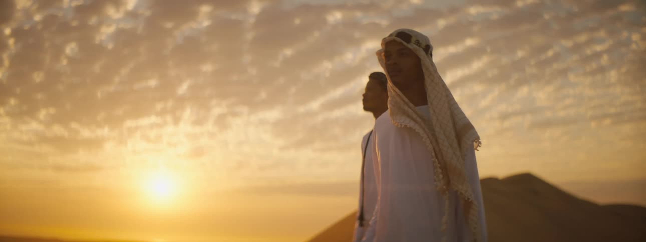Two people looking out across the desert
