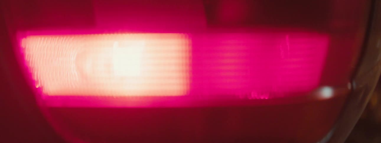 A headlight flashing on a car