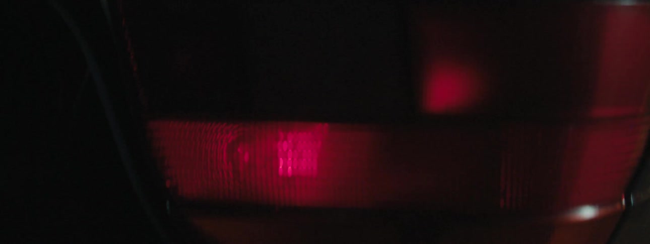 The flashing taillight of vehicle outdoors at night