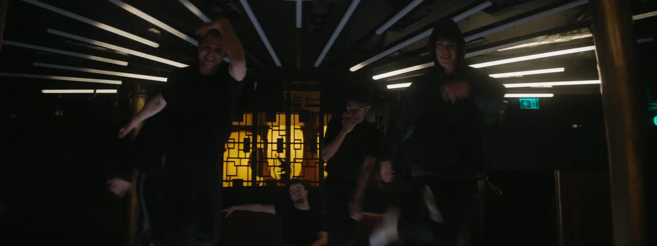 A group of male friends dancing