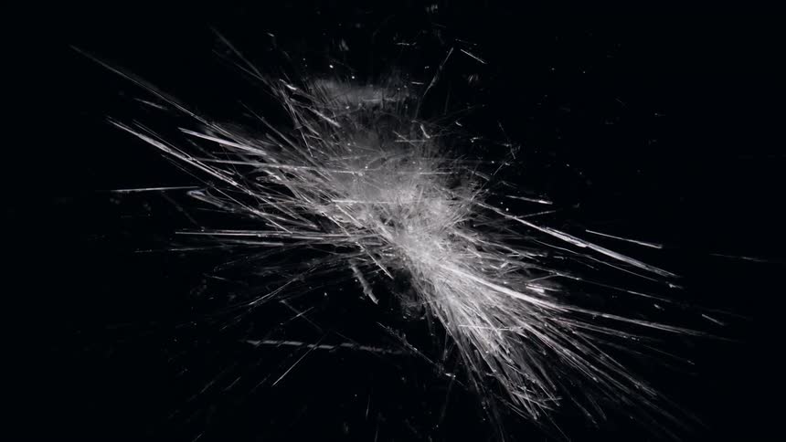 Fibers that look like shards of glass expand in the darkness