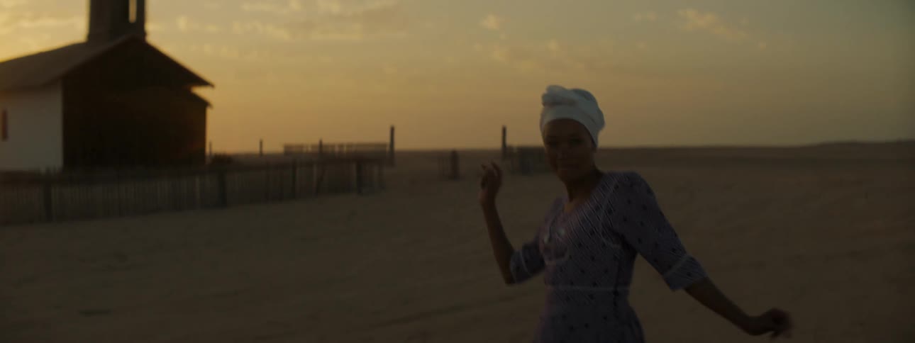A young woman dancing in a rural area